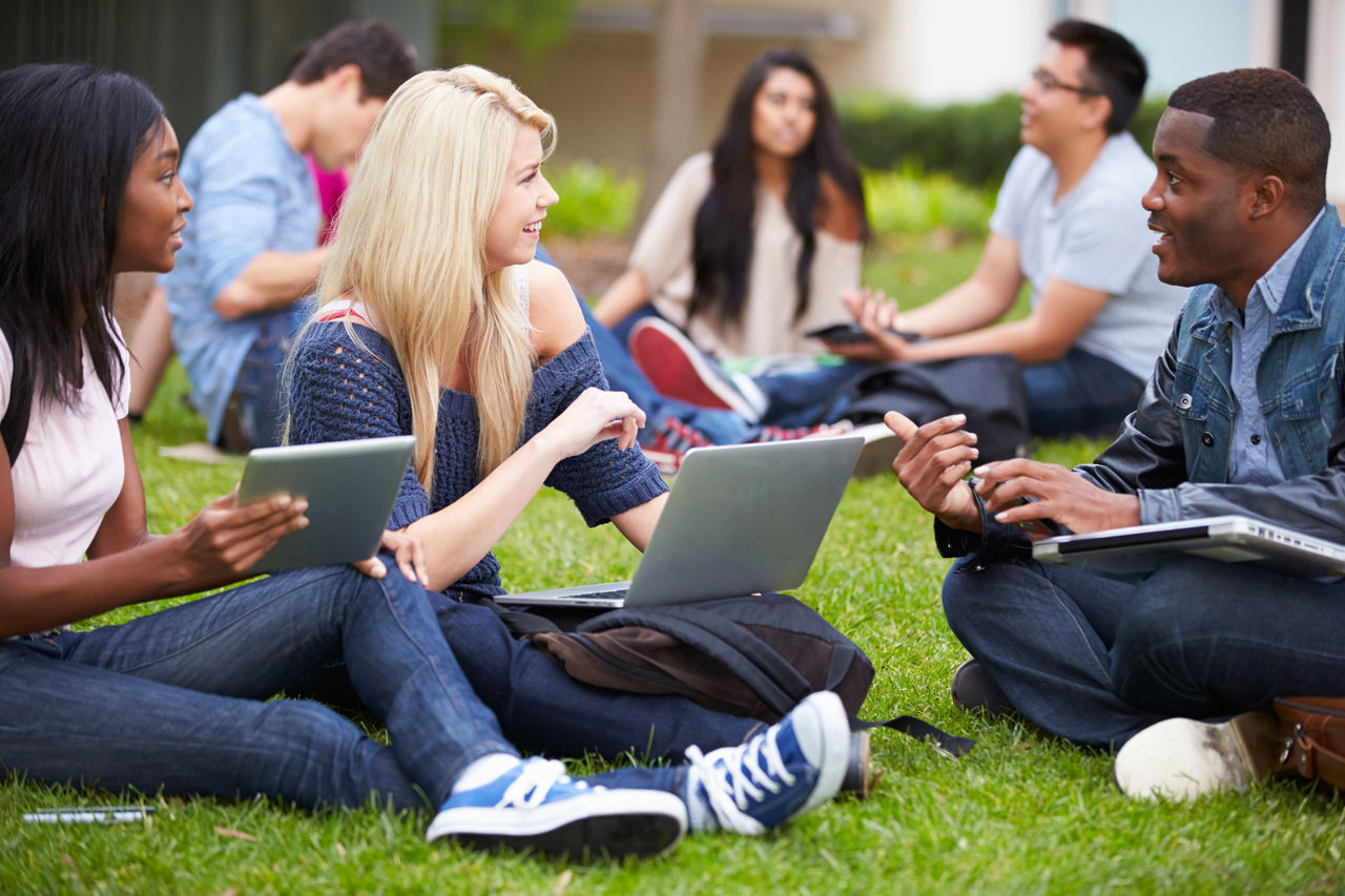 Group Of University Students Working Outside Together