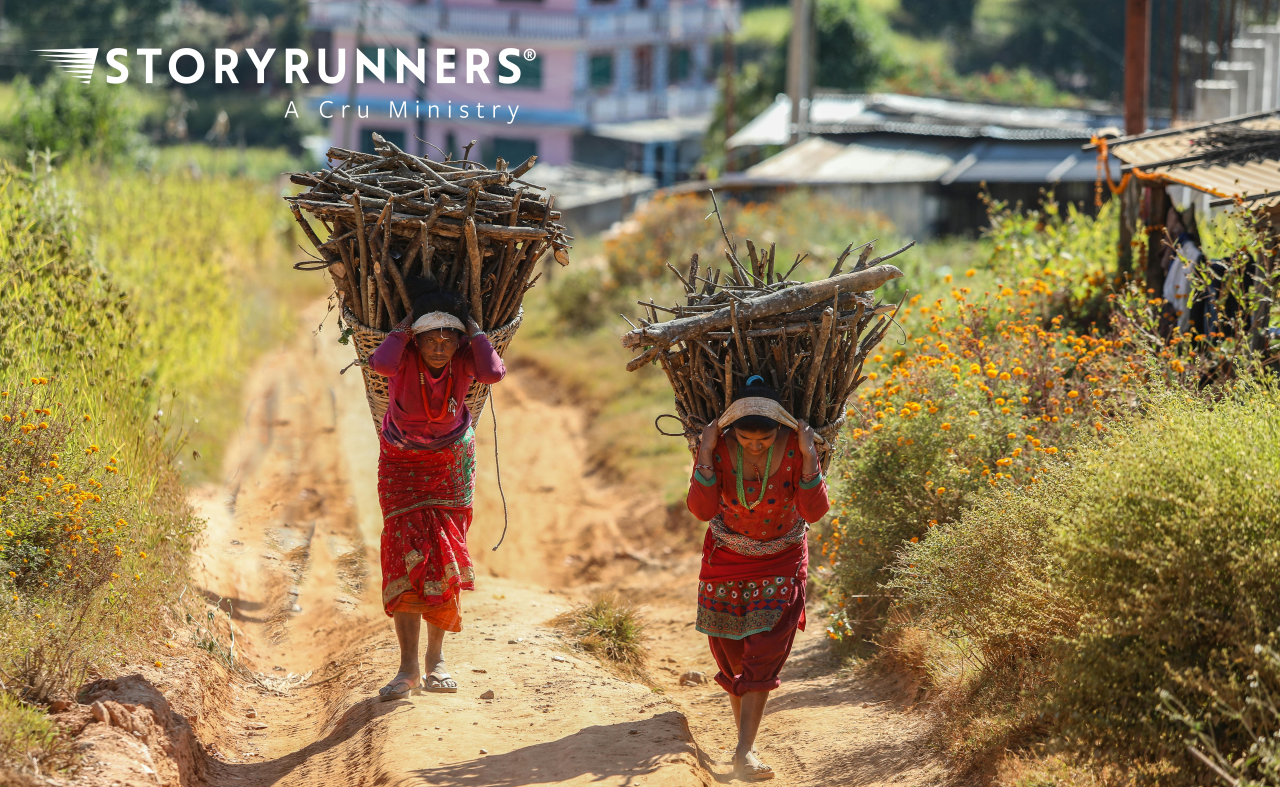 Women carrying wood in baskets on their head