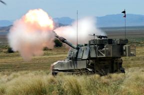 At the Dugway Proving Grounds, Dugway, Utah (UT), the Utah Army National Guard (UTARNG) 2nd Battalion (BN), 222nd Field Artillery (FA) (2/222), Cedar City, Utah (UT), displays the capabilities of its M109A6 Paladin Self Propelled Howitzers during 04 Patriot exercise.